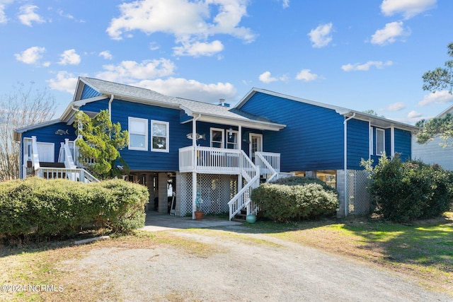 view of front facade featuring a carport and a porch