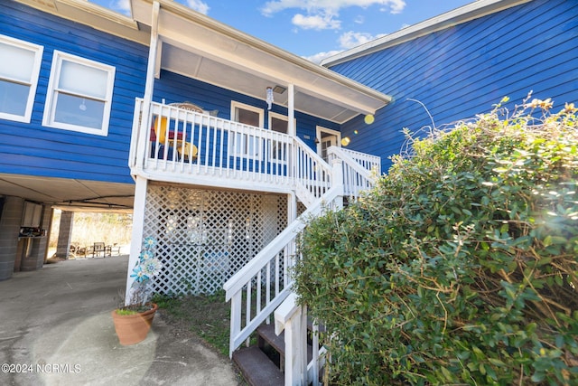 view of home's exterior featuring a carport