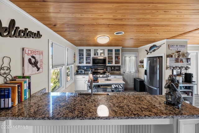 kitchen featuring wooden ceiling, stainless steel appliances, backsplash, crown molding, and white cabinets