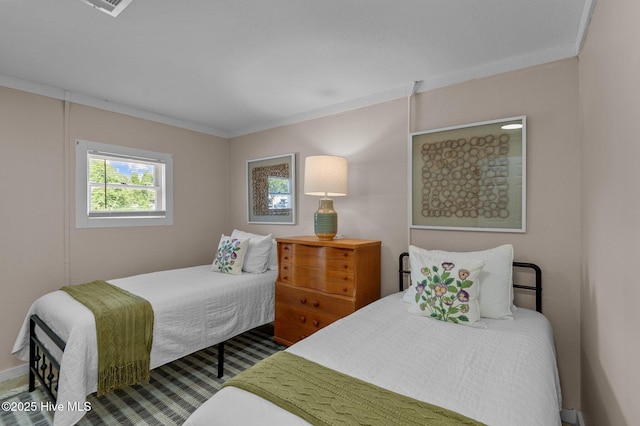 bedroom featuring crown molding