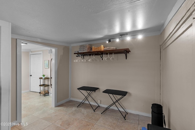 interior space featuring a textured ceiling