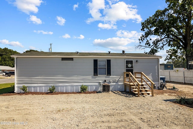 back of house featuring central air condition unit