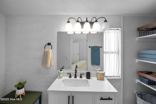 bathroom featuring vanity and a textured ceiling