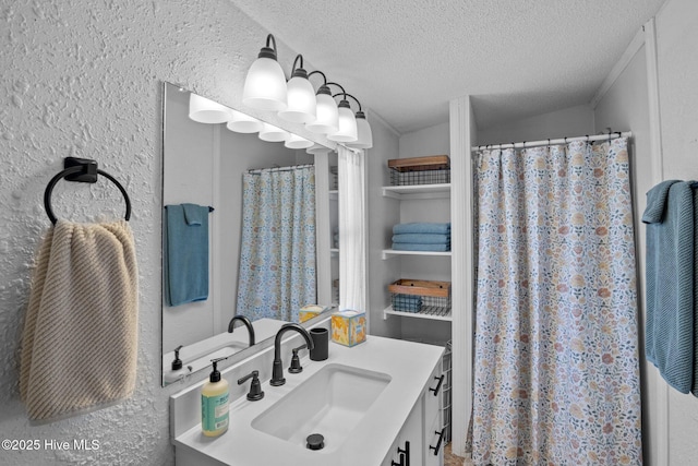 bathroom featuring vanity, a textured ceiling, vaulted ceiling, and walk in shower