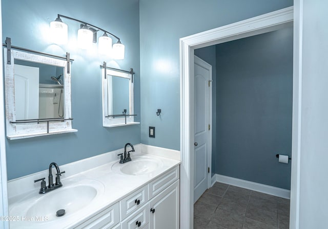 bathroom with tile patterned floors and vanity