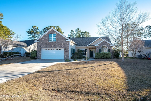 view of front property featuring a garage and a front yard