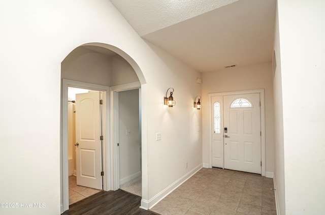 entrance foyer with a textured ceiling