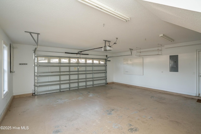 garage with electric panel and a garage door opener