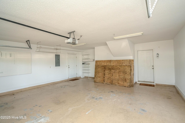 garage featuring electric panel and a garage door opener