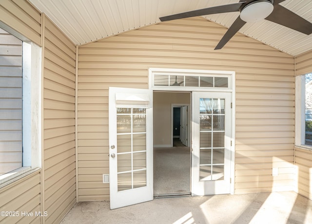 entrance to property featuring ceiling fan and a patio