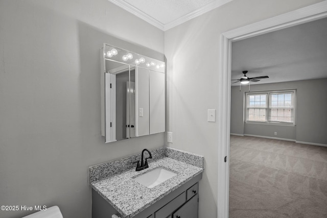 bathroom featuring vanity, a textured ceiling, ceiling fan, and crown molding