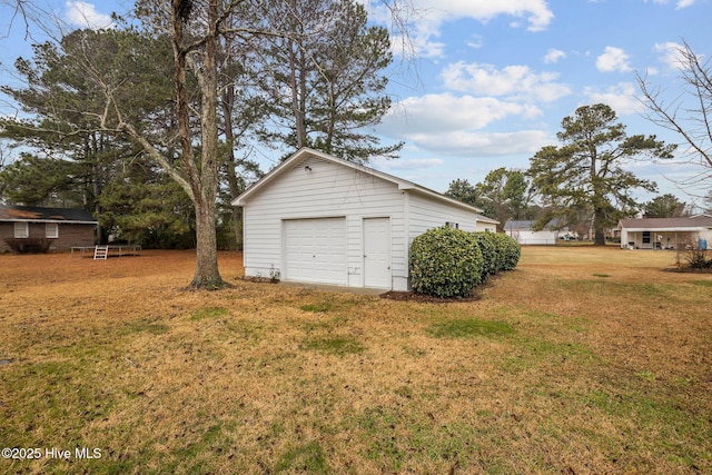 garage featuring a yard