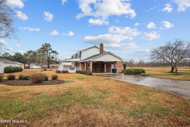 view of front of house with a porch and a front lawn