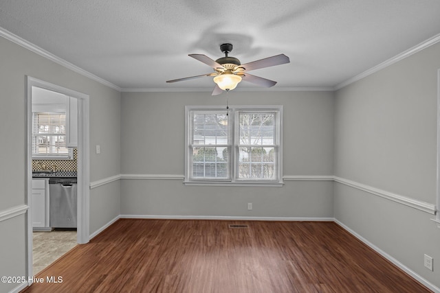 unfurnished room featuring crown molding, ceiling fan, and hardwood / wood-style flooring