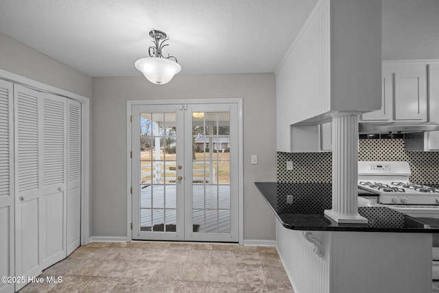 doorway with a textured ceiling and french doors