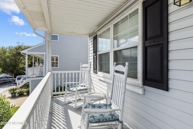 balcony featuring a porch