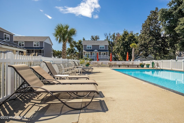 view of swimming pool featuring a patio area