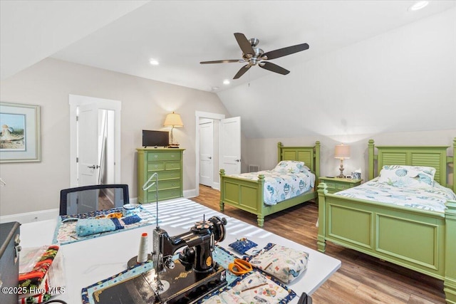 bedroom with lofted ceiling, a ceiling fan, wood finished floors, recessed lighting, and baseboards