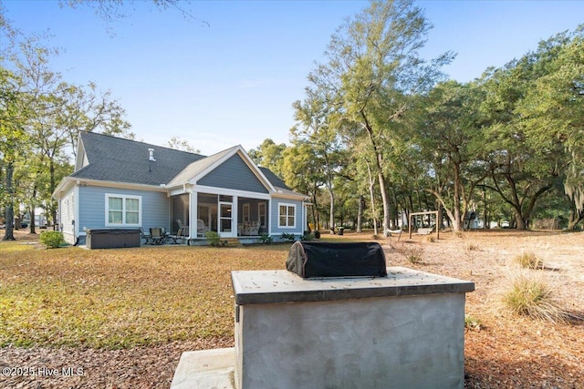 back of house with a sunroom