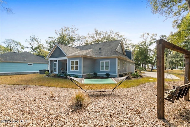 back of house with a sunroom