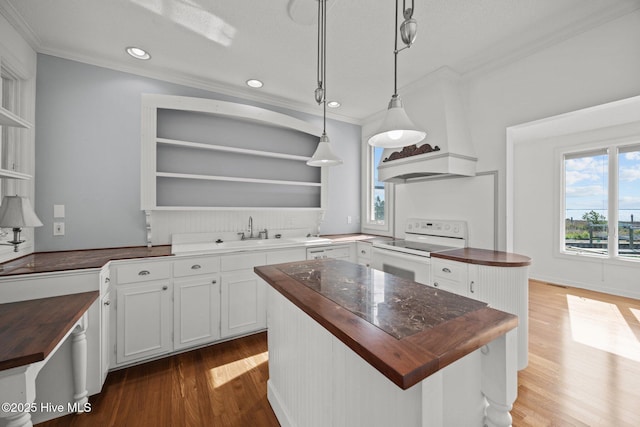 kitchen with white electric range oven, open shelves, ornamental molding, and butcher block countertops