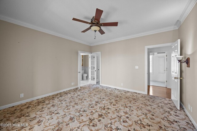 530 E St, Belhaven, NC 27810 - carpeted spare room with crown molding, baseboards, ceiling fan, and french doors