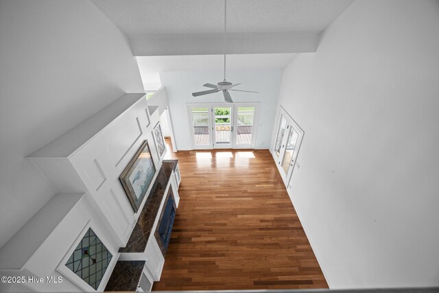530 E St, Belhaven, NC 27810 - unfurnished living room featuring ceiling fan, a glass covered fireplace, and wood finished floors