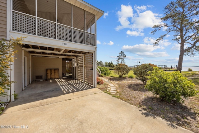 exterior space with driveway and a carport