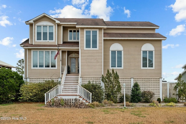 view of front of home with a front yard