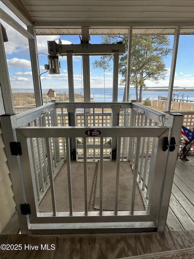 sunroom with a water view