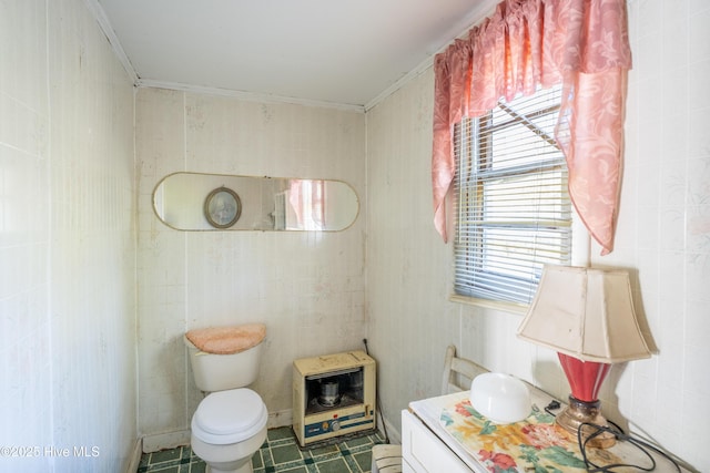 bathroom featuring tile patterned flooring, vanity, toilet, and ornamental molding