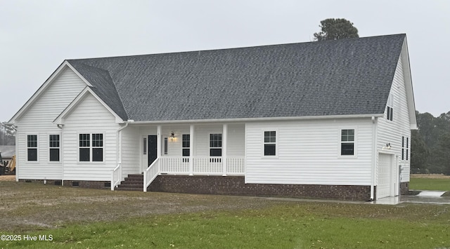 view of front of home featuring covered porch and a garage