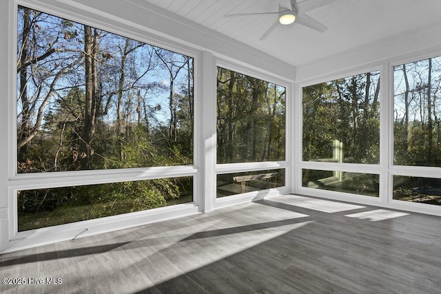 unfurnished sunroom featuring plenty of natural light and ceiling fan