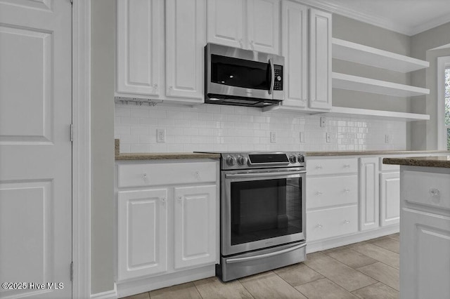 kitchen with tasteful backsplash, white cabinetry, stainless steel appliances, and ornamental molding