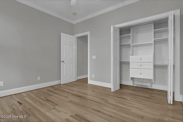 unfurnished bedroom with ceiling fan, light hardwood / wood-style floors, ornamental molding, and a closet