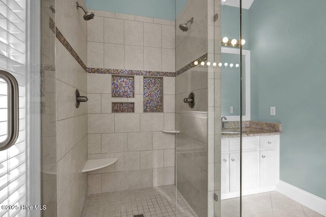 bathroom featuring tile patterned flooring and an enclosed shower