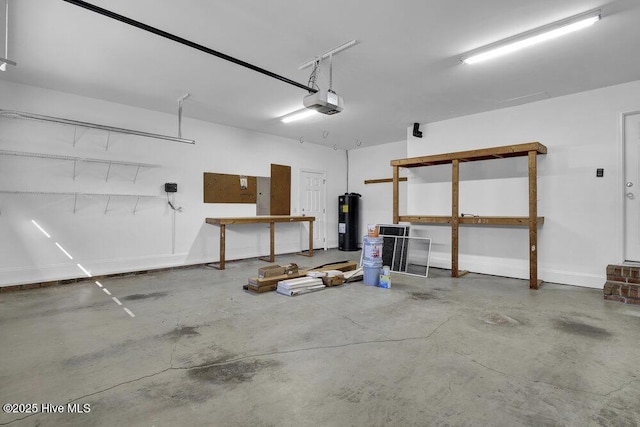 garage featuring electric water heater and a garage door opener