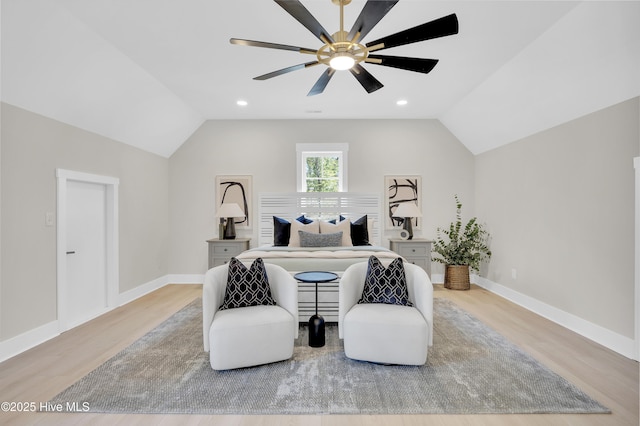 bedroom with vaulted ceiling, ceiling fan, and light wood-type flooring