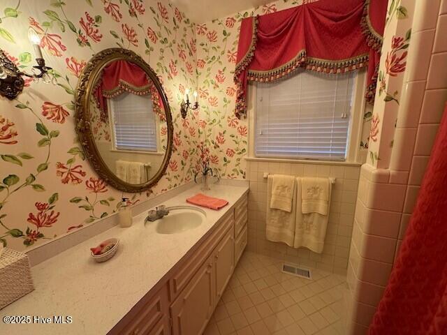 bathroom featuring tile patterned floors and vanity