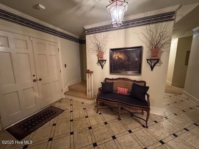 foyer entrance featuring ornamental molding