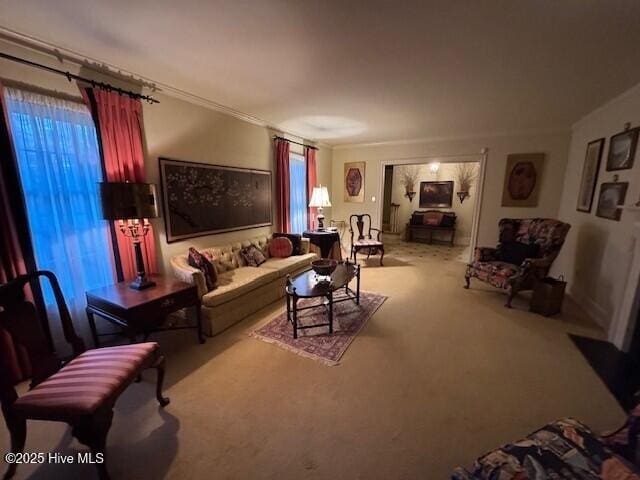 carpeted living room with ornamental molding