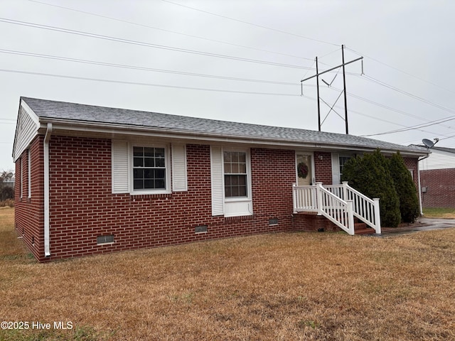 ranch-style house featuring a front lawn