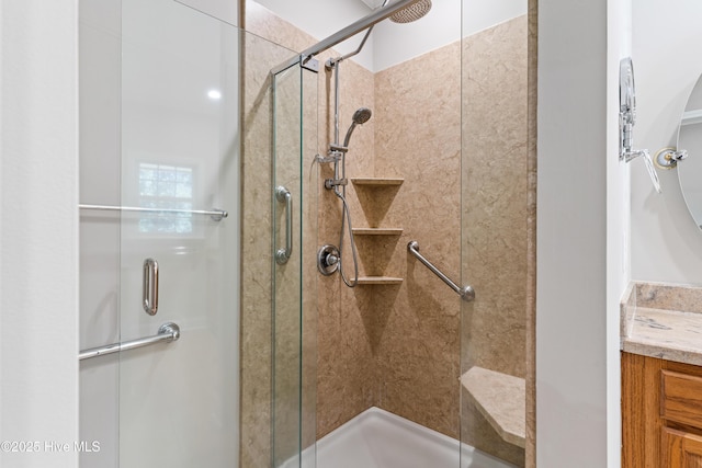 bathroom with vanity and an enclosed shower