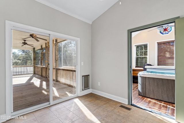 entryway featuring light tile patterned floors and lofted ceiling