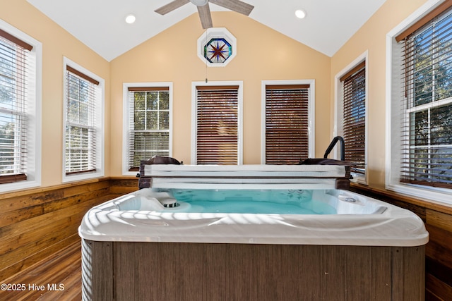 interior space with lofted ceiling and a hot tub