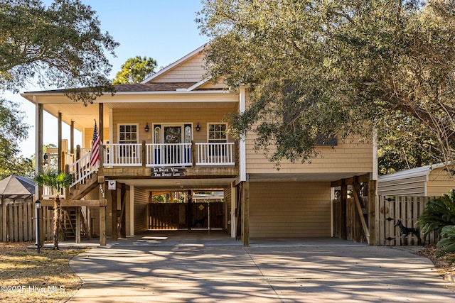 view of front of home featuring a carport and a porch