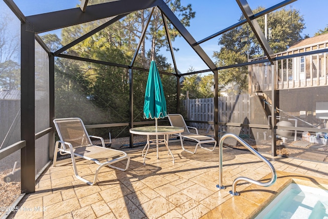 view of patio / terrace with a lanai