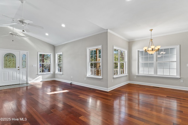 interior space featuring ceiling fan with notable chandelier, dark hardwood / wood-style floors, crown molding, and lofted ceiling