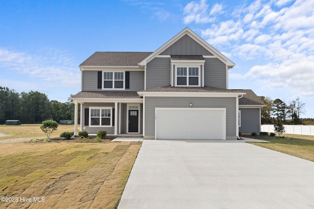 view of front of home with a garage and a front lawn