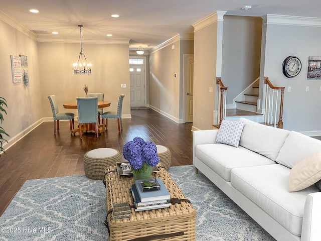 living room featuring crown molding, an inviting chandelier, and dark hardwood / wood-style flooring